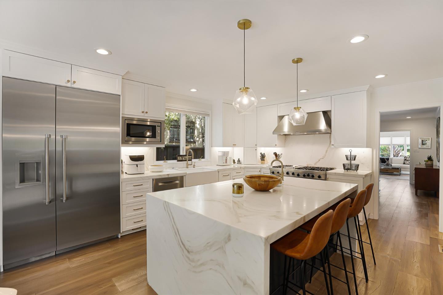 1467 Cabrillo Avenue Burlingame, CA 94010 - Photo 21 of 57 a kitchen with stainless steel appliances granite countertop a sink a stove a refrigerator and island with wooden floor