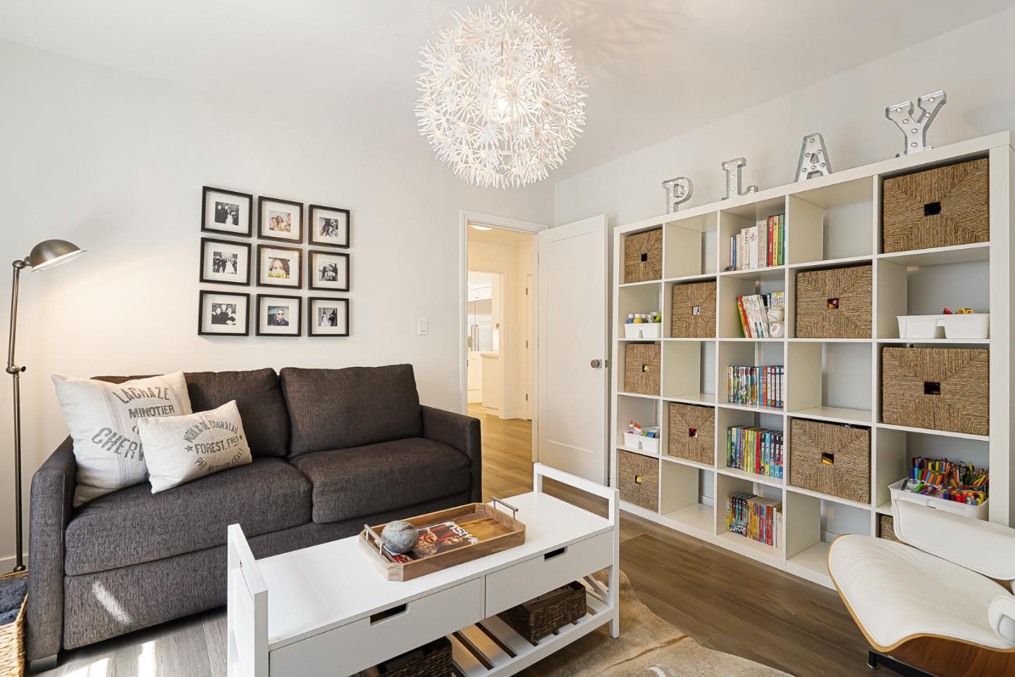 1467 Cabrillo Avenue Burlingame, CA 94010 - Photo 26 of 57 a living room with furniture and a book shelf
