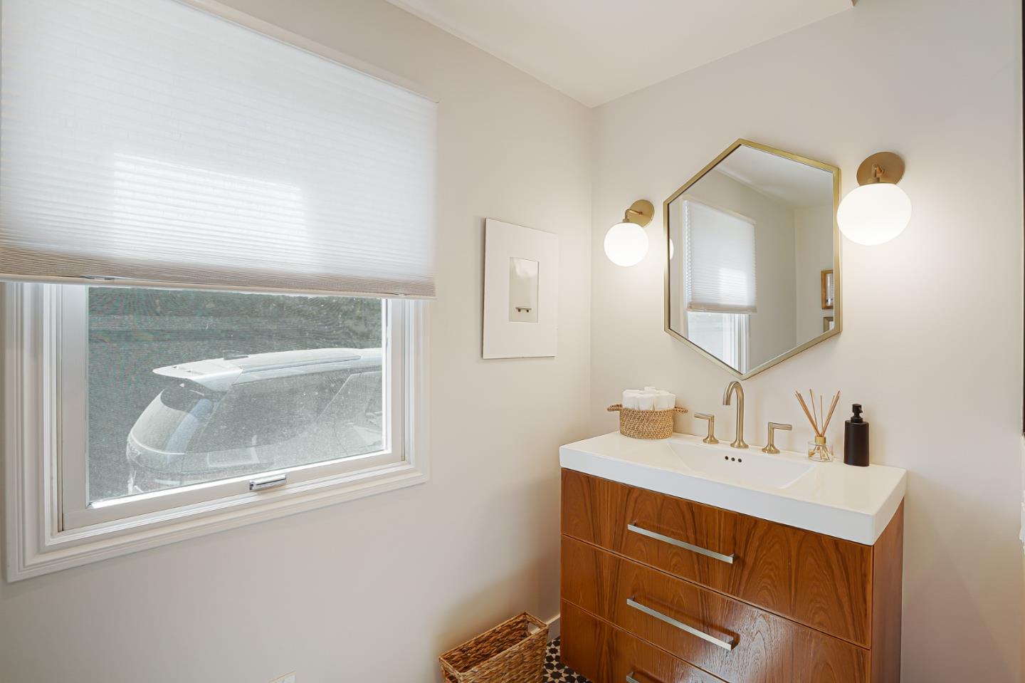 1467 Cabrillo Avenue Burlingame, CA 94010 - Photo 30 of 57 a bathroom with a sink mirror and vanity