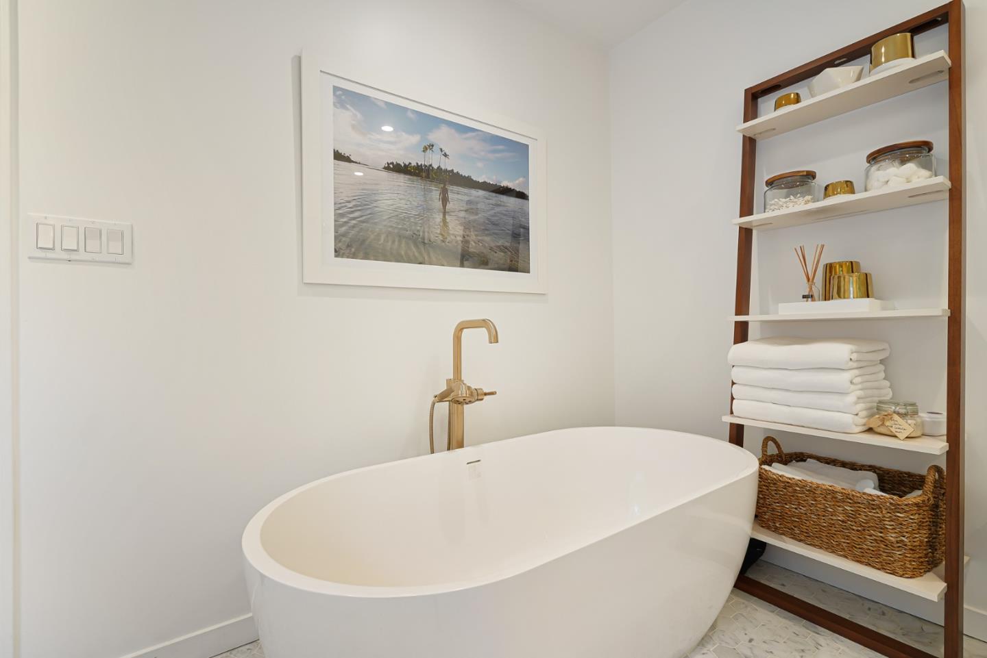 1467 Cabrillo Avenue Burlingame, CA 94010 - Photo 38 of 57 a white bath tub sitting next to a white sink and a mirror