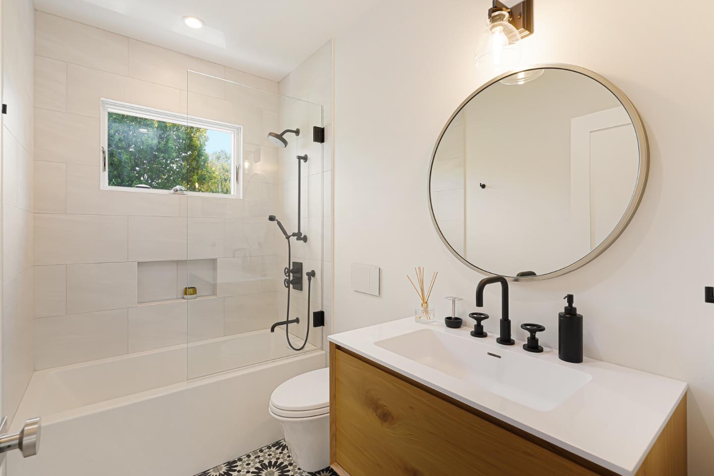 1467 Cabrillo Avenue Burlingame, CA 94010 - Photo 42 of 57 a bathroom with a sink a toilet and a mirror