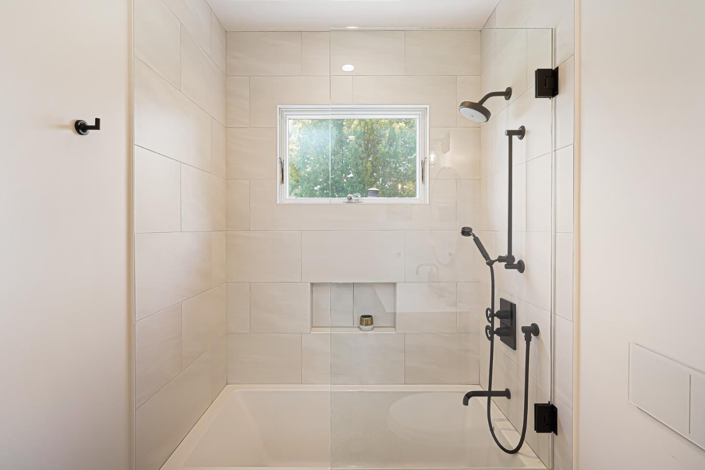1467 Cabrillo Avenue Burlingame, CA 94010 - Photo 43 of 57 a bathroom with a bathtub and shower