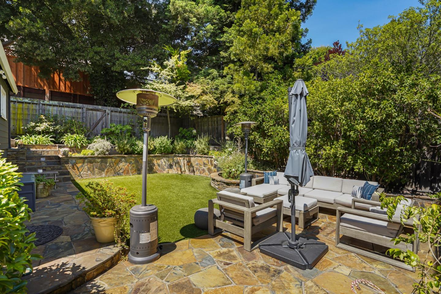 1467 Cabrillo Avenue Burlingame, CA 94010 - Photo 51 of 57 a view of a patio with table and chairs potted plants with wooden fence