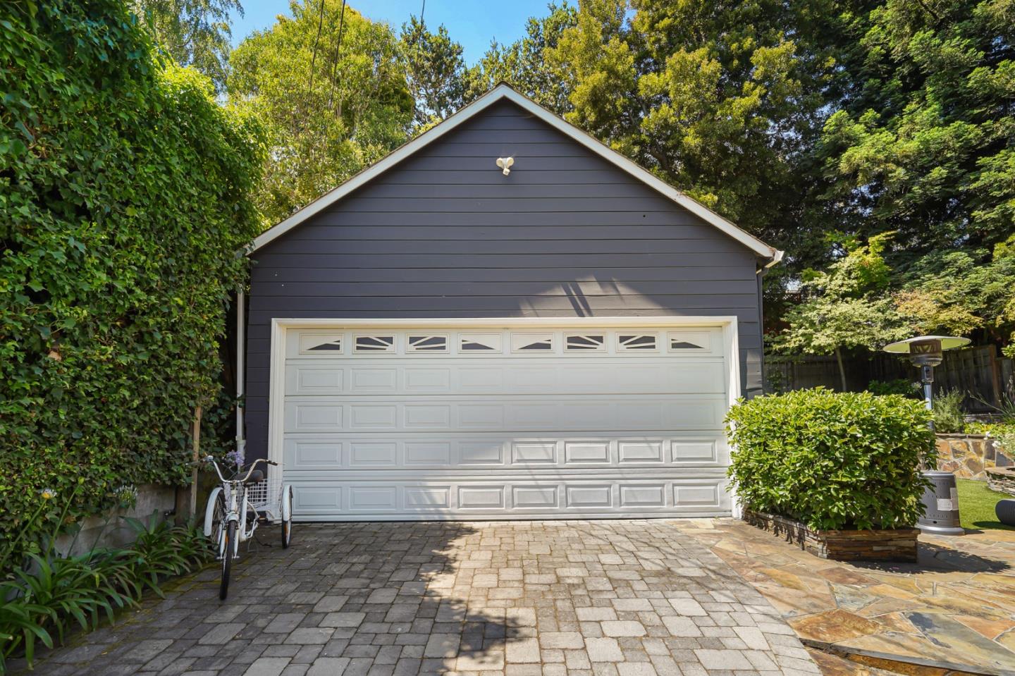 1467 Cabrillo Avenue Burlingame, CA 94010 - Photo 57 of 57 a view of a house with a small yard and a garage