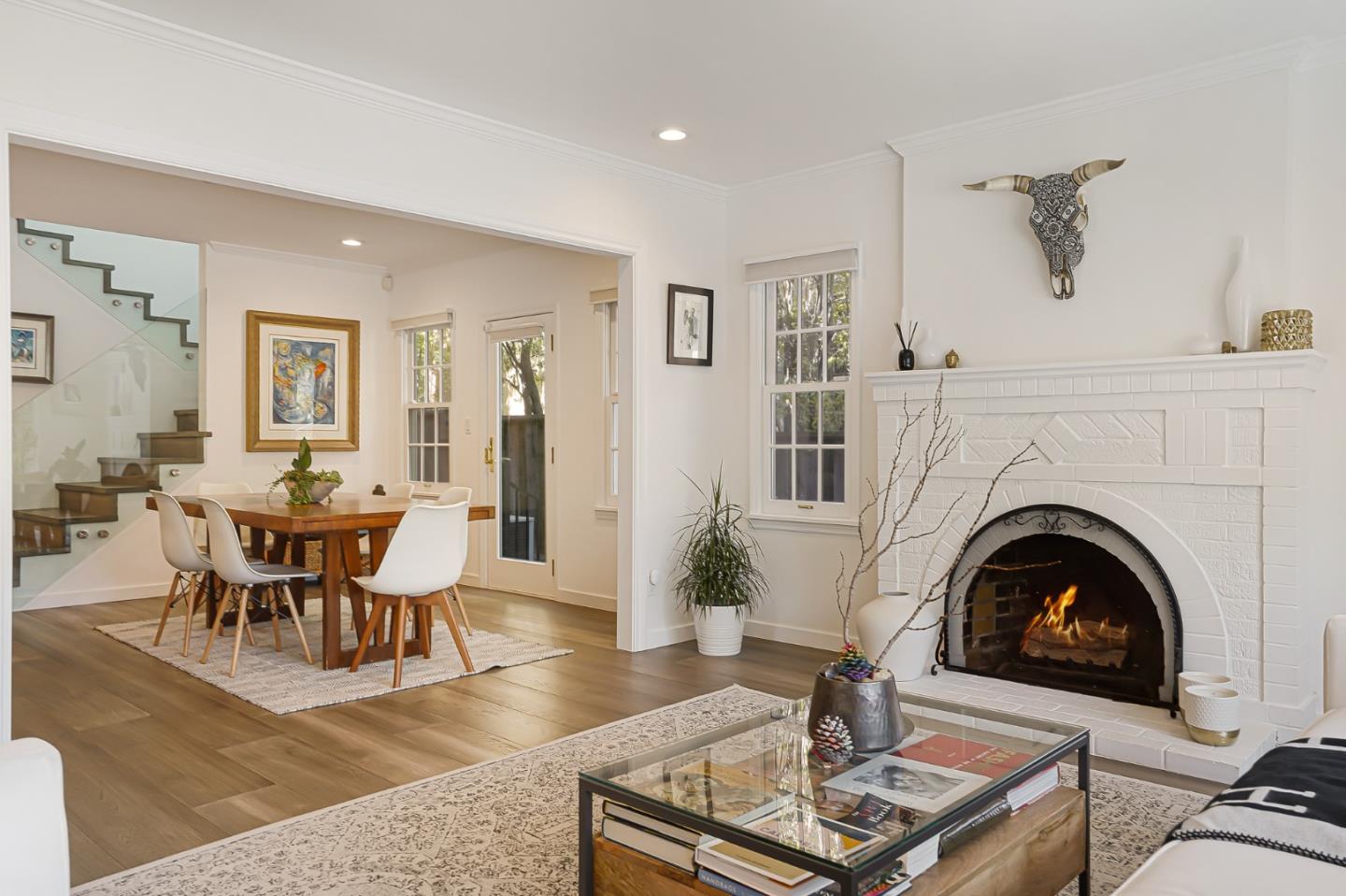 1467 Cabrillo Avenue Burlingame, CA 94010 - Photo 10 of 57 a living room with furniture a fireplace and a table