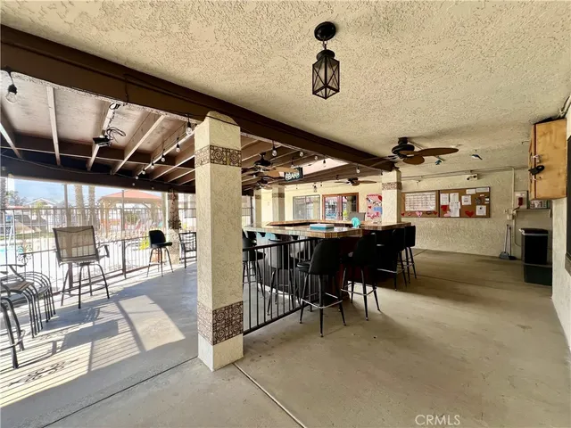 a view of a patio with table and chairs
