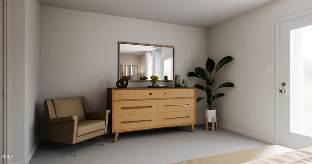 a room with a chair and a potted plant