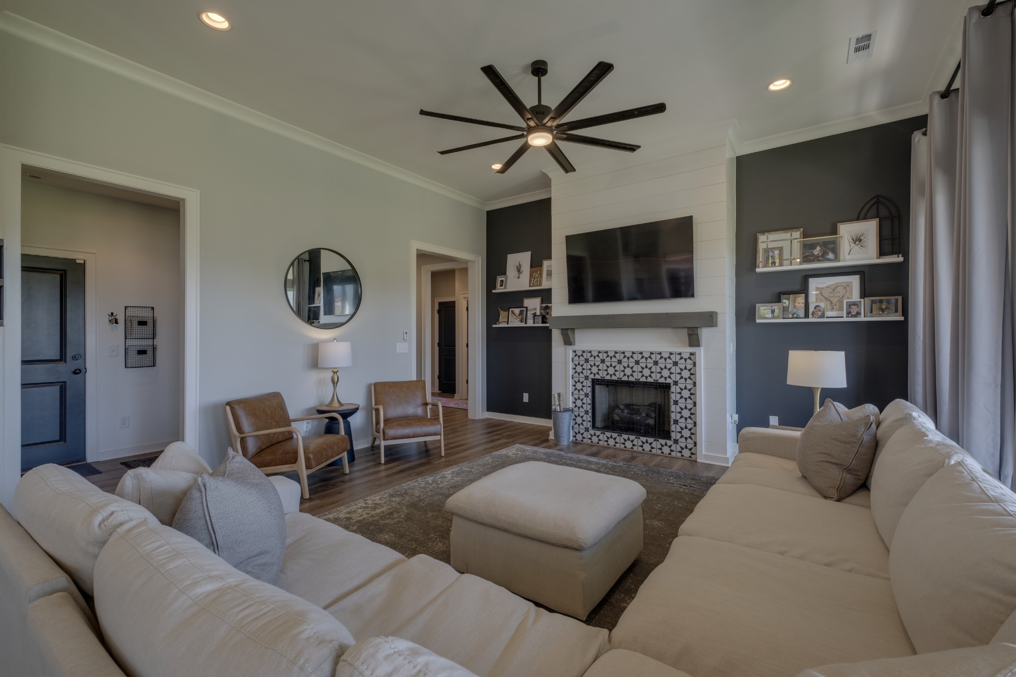 1017 Fallow Road Mount Juliet, TN 37122 - Photo 16 of 66 a living room with furniture a flat screen tv and a fireplace