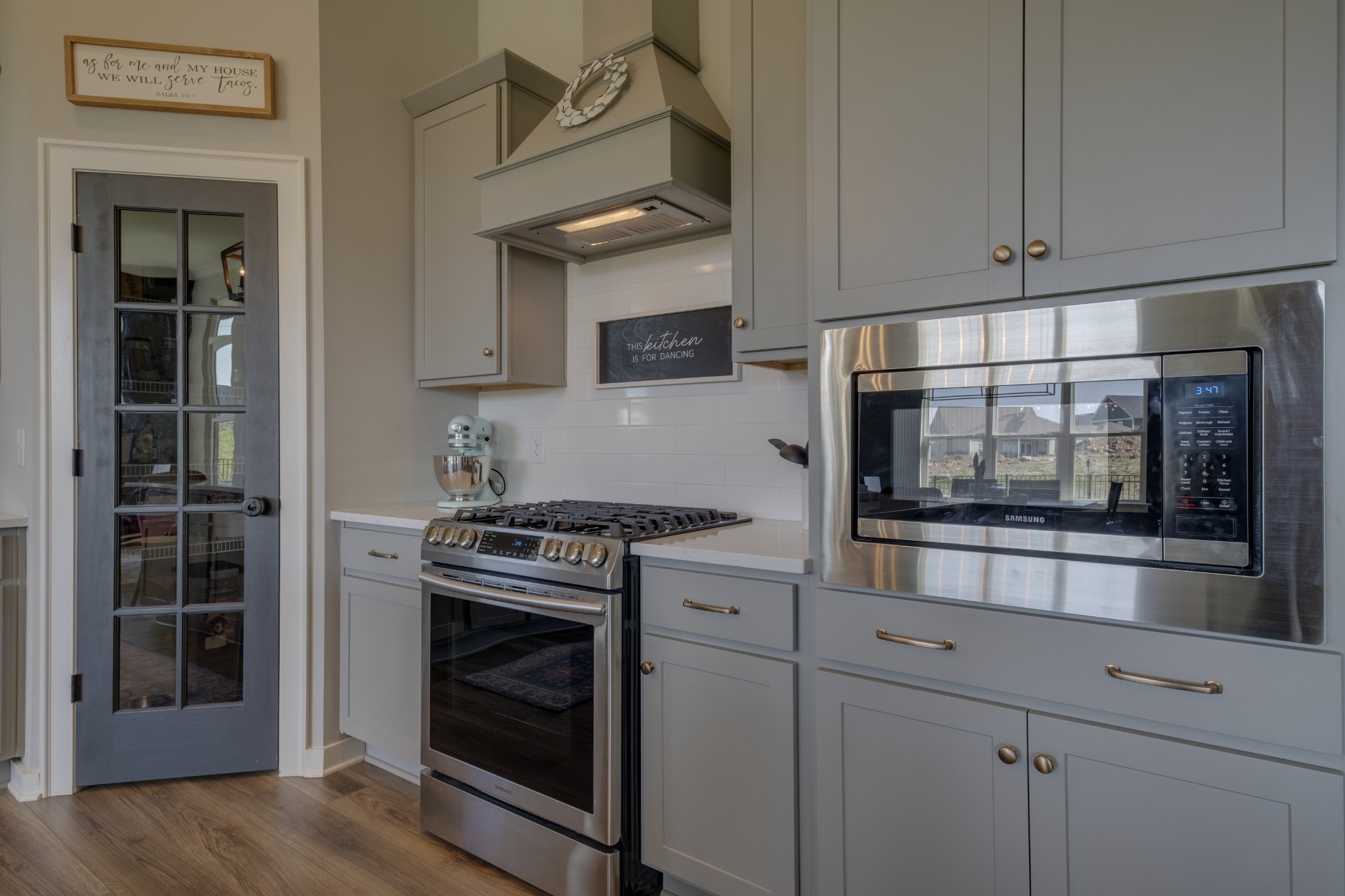 1017 Fallow Road Mount Juliet, TN 37122 - Photo 17 of 66 a kitchen with stainless steel appliances granite countertop a stove and a microwave