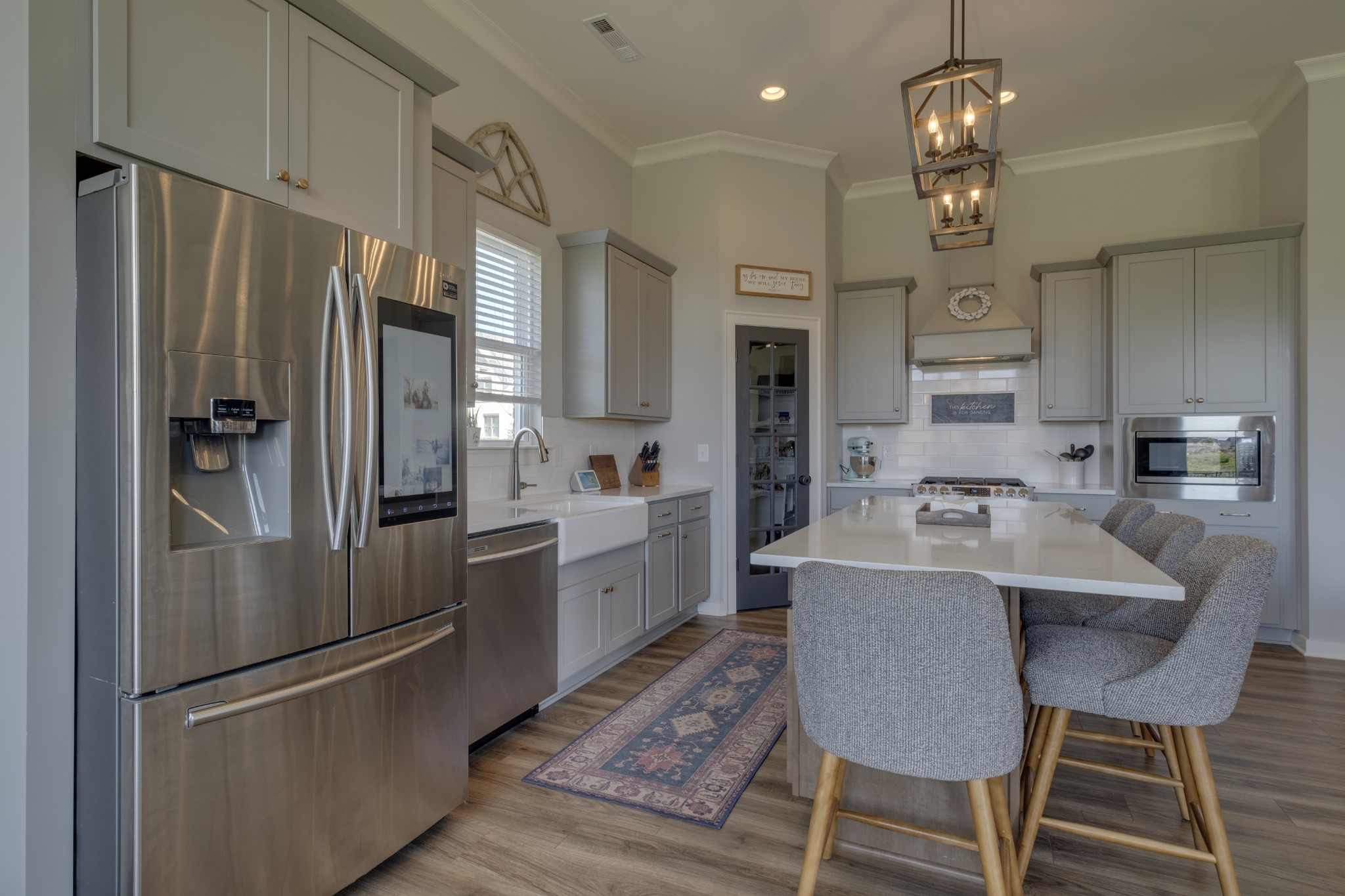 1017 Fallow Road Mount Juliet, TN 37122 - Photo 20 of 66 a kitchen with kitchen island a refrigerator and a sink