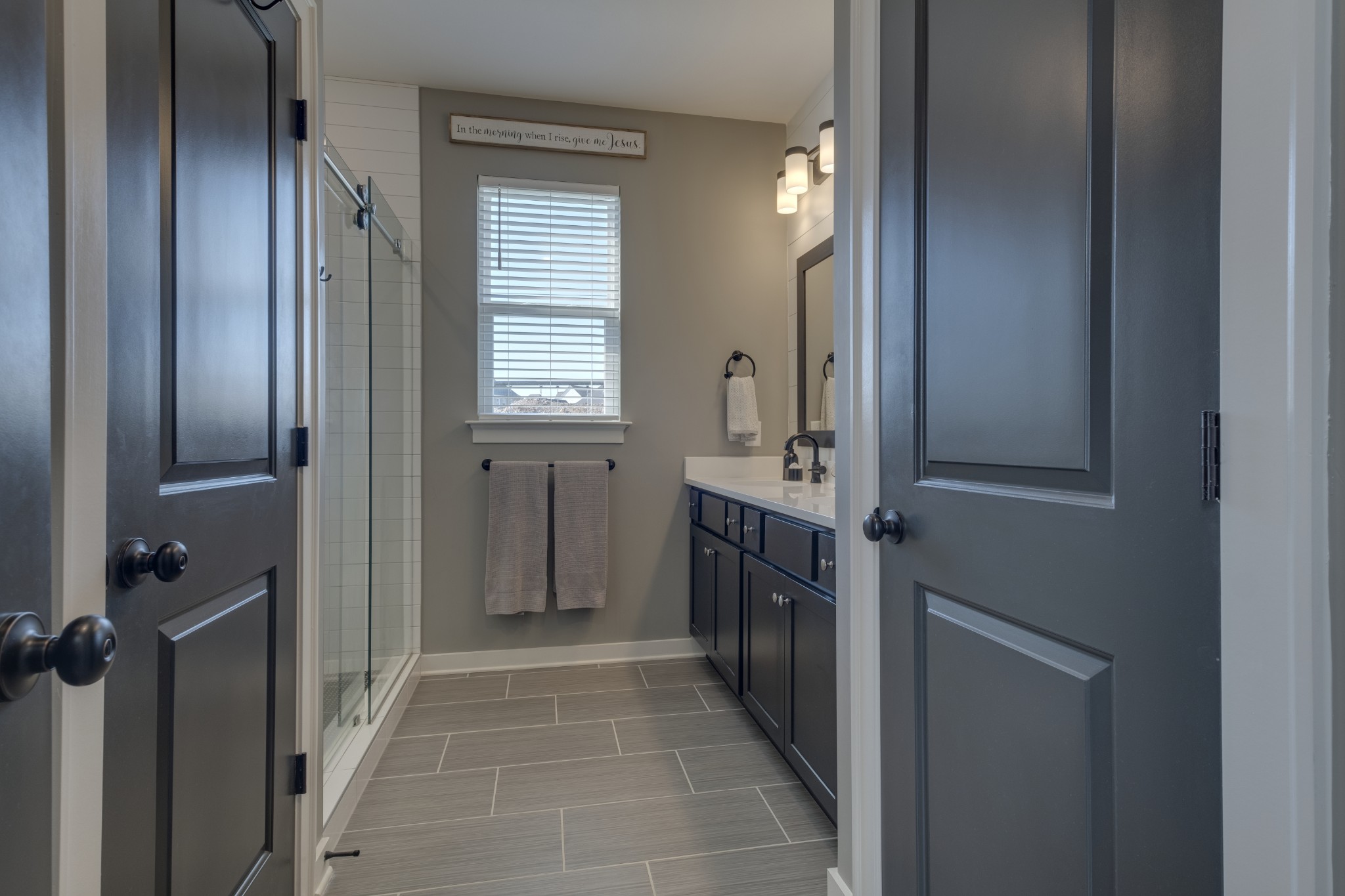 1017 Fallow Road Mount Juliet, TN 37122 - Photo 29 of 66 a bathroom with a sink a mirror and a shower