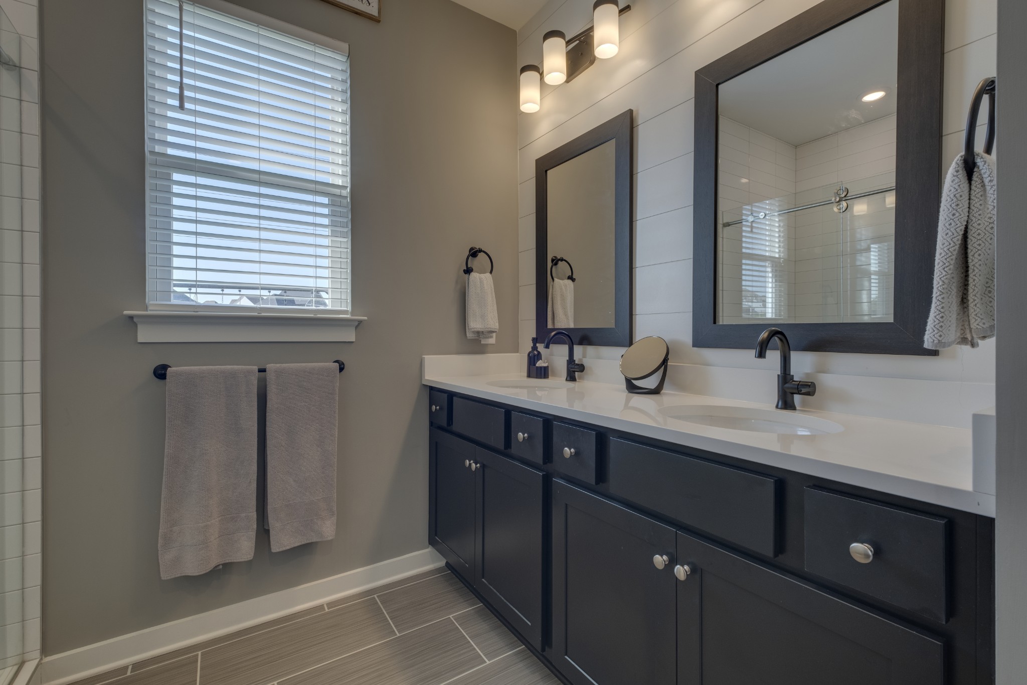 1017 Fallow Road Mount Juliet, TN 37122 - Photo 30 of 66 a bathroom with a double vanity sink and a mirror