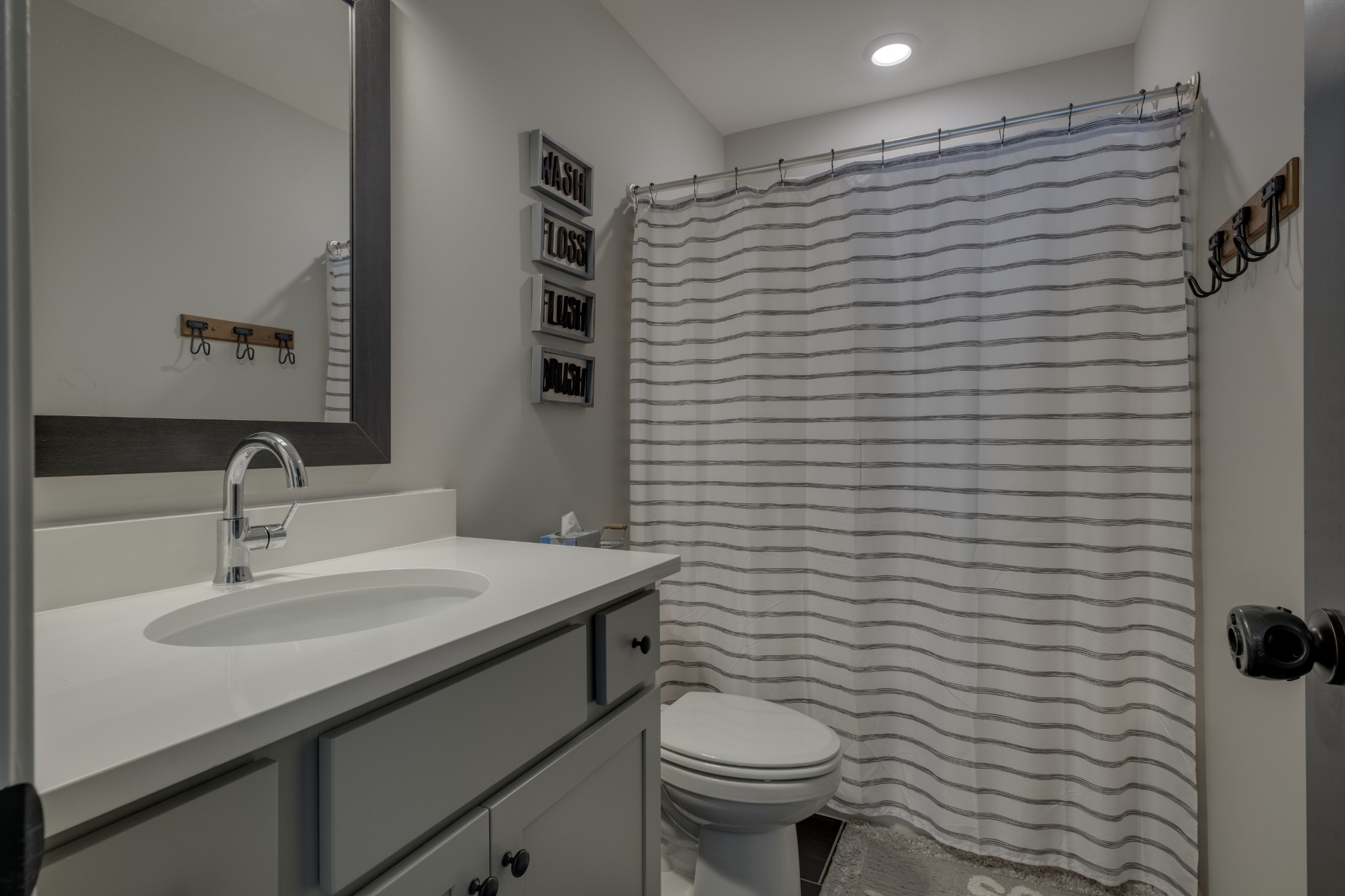 1017 Fallow Road Mount Juliet, TN 37122 - Photo 40 of 66 a bathroom with a sink toilet and mirror