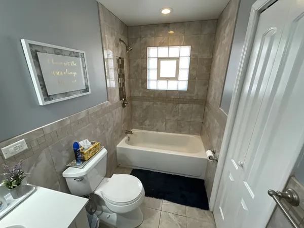 a bathroom with a toilet sink and bathtub