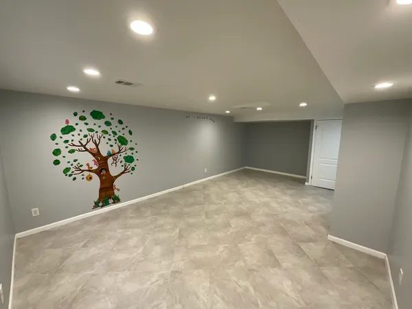 an empty room with potted plant