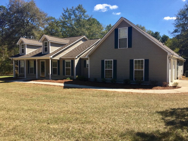 3416 Lower Hartley Bridge Road Byron, GA 31008 - Photo 1 of 28 a front view of a house with a yard