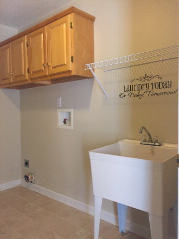 3416 Lower Hartley Bridge Road Byron, GA 31008 - Photo 13 of 28 a bathroom with a sink and cabinets