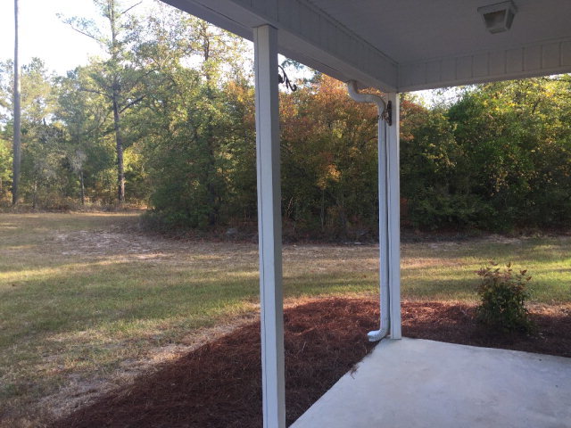 3416 Lower Hartley Bridge Road Byron, GA 31008 - Photo 24 of 28 a view of a glass door and a yard