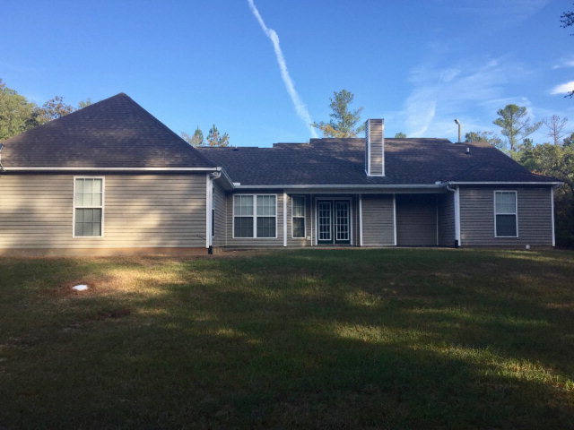 3416 Lower Hartley Bridge Road Byron, GA 31008 - Photo 27 of 28 a front view of a house with a garden