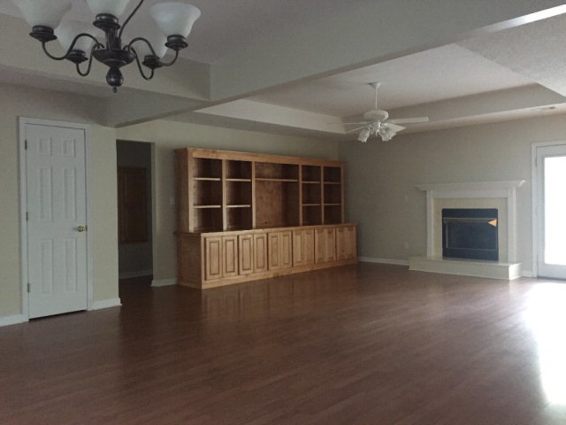 3416 Lower Hartley Bridge Road Byron, GA 31008 - Photo 4 of 28 a view of an empty room with a fireplace and a window