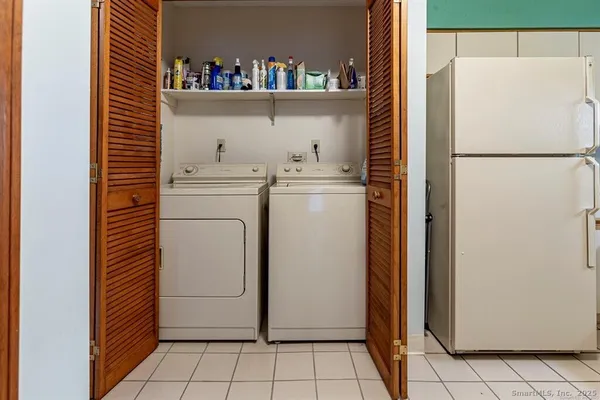 a utility room with dryer and washer