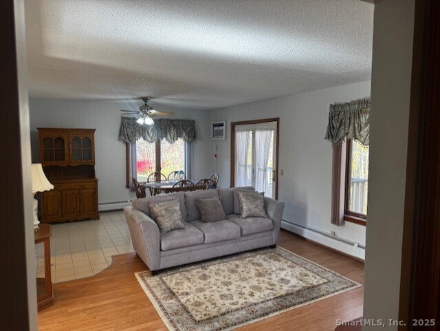 24 Millbrook Court Newington, CT 06111 - Photo 2 of 12 a living room with furniture and a rug