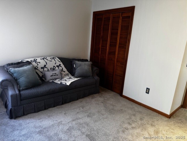 24 Millbrook Court Newington, CT 06111 - Photo 5 of 12 a living room with furniture and a window