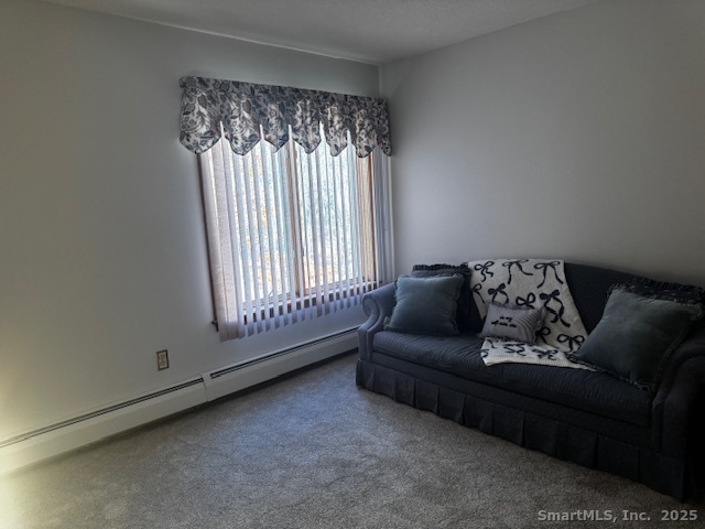 24 Millbrook Court Newington, CT 06111 - Photo 6 of 12 a living room with furniture and a large window