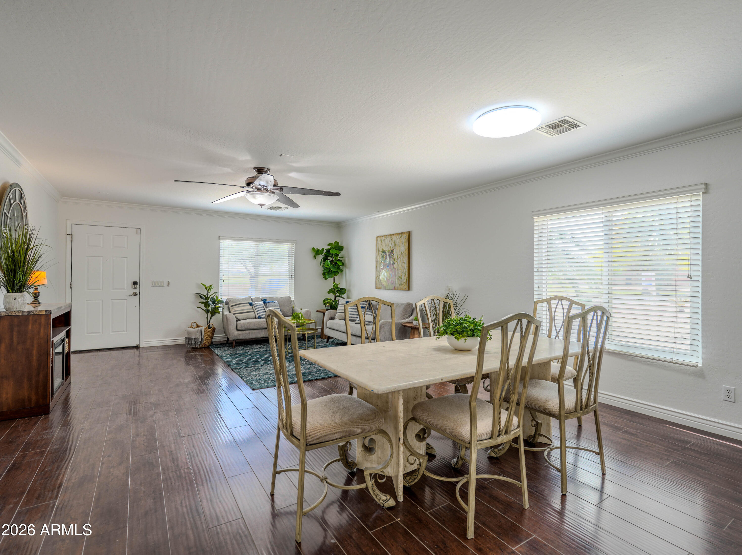 3378 East Silverbell Road San Tan Valley, AZ 85143 - Photo 13 of 61 a view of a dining room with furniture and wooden floor