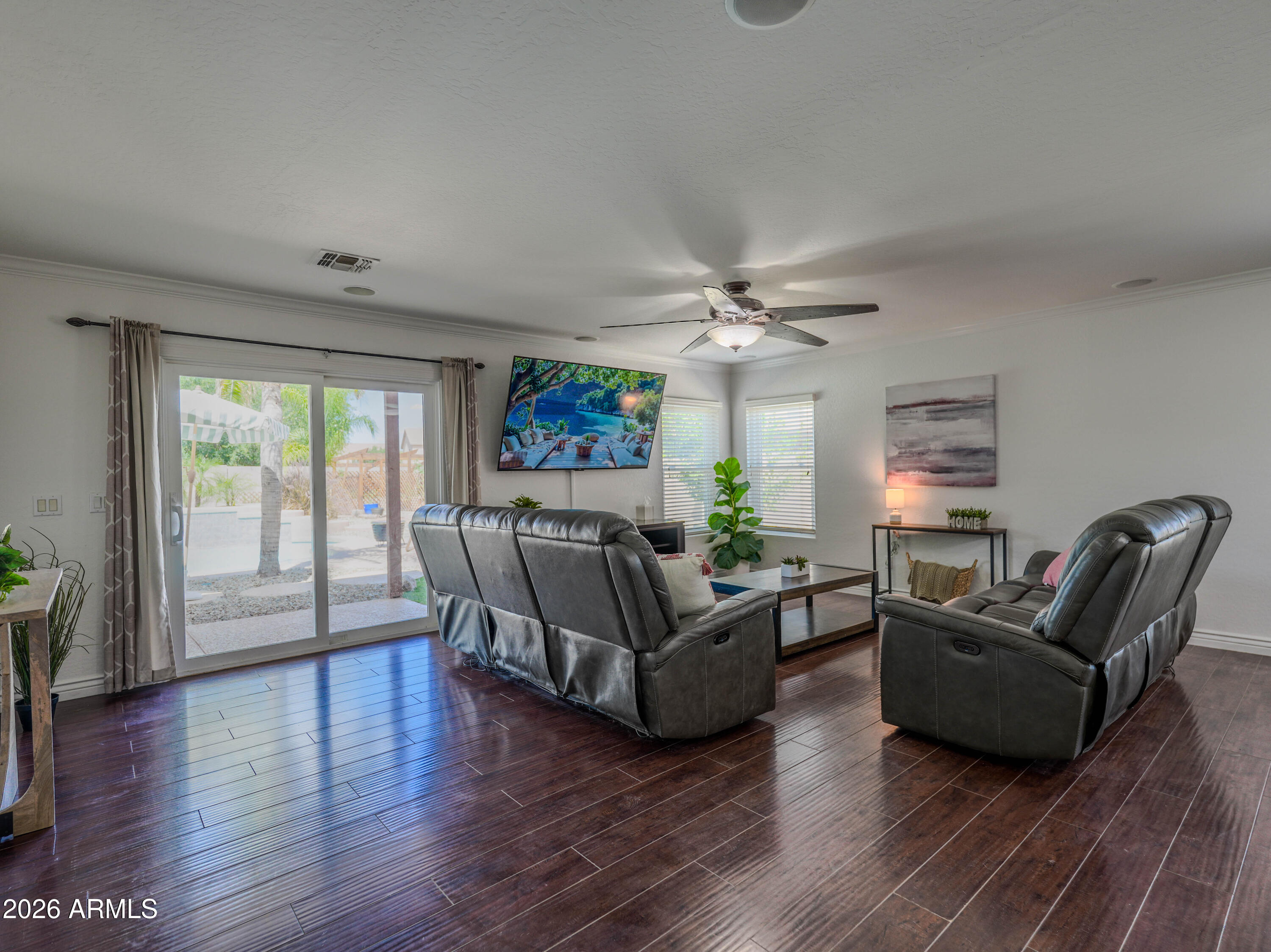3378 East Silverbell Road San Tan Valley, AZ 85143 - Photo 15 of 61 a living room with furniture and a large window