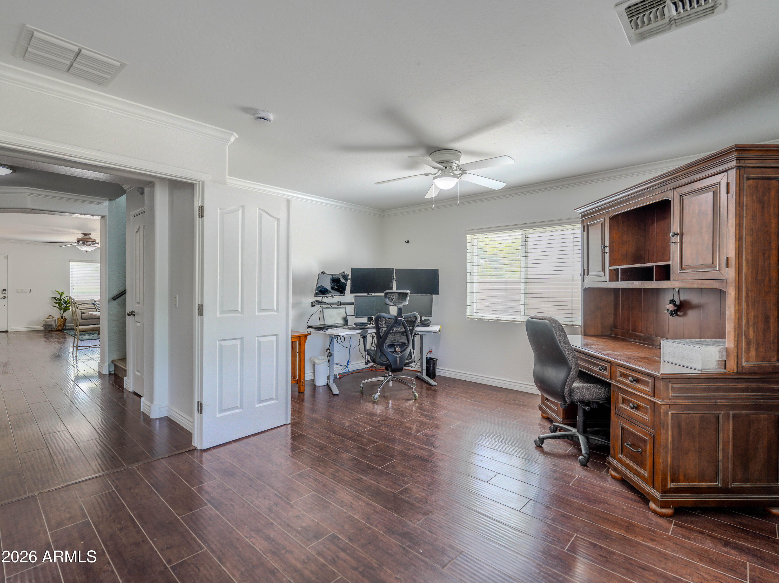 3378 East Silverbell Road San Tan Valley, AZ 85143 - Photo 25 of 61 a view of a livingroom with furniture and a flat screen tv
