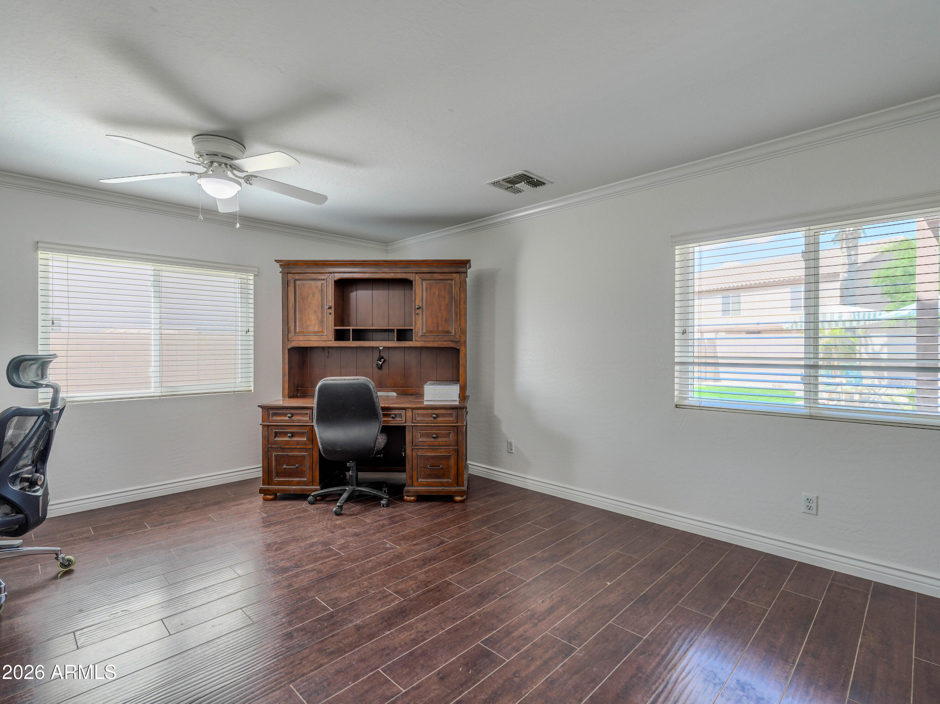 3378 East Silverbell Road San Tan Valley, AZ 85143 - Photo 26 of 61 a view of a workspace with furniture and a window