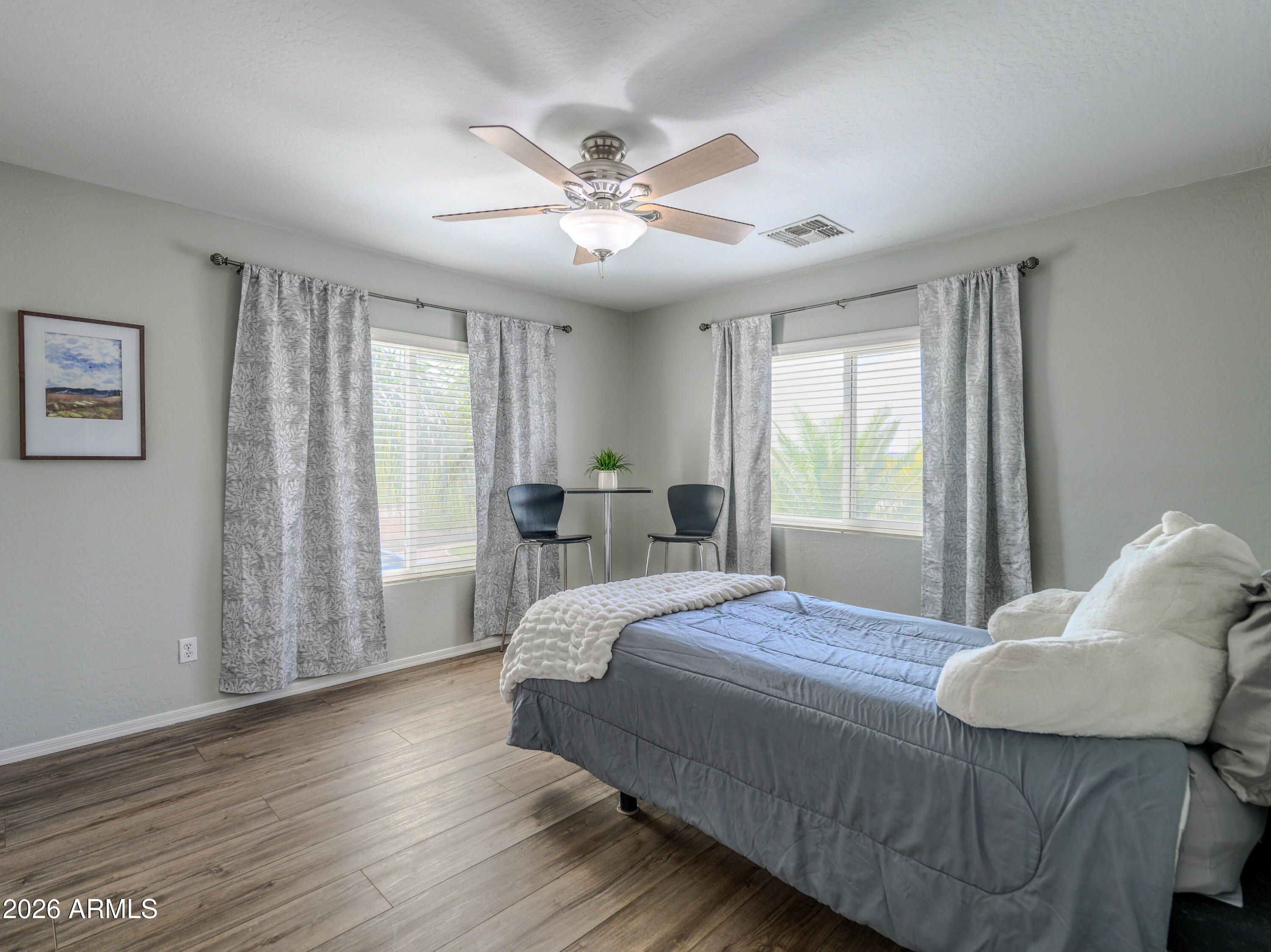 3378 East Silverbell Road San Tan Valley, AZ 85143 - Photo 33 of 61 a bedroom with a large bed and a window