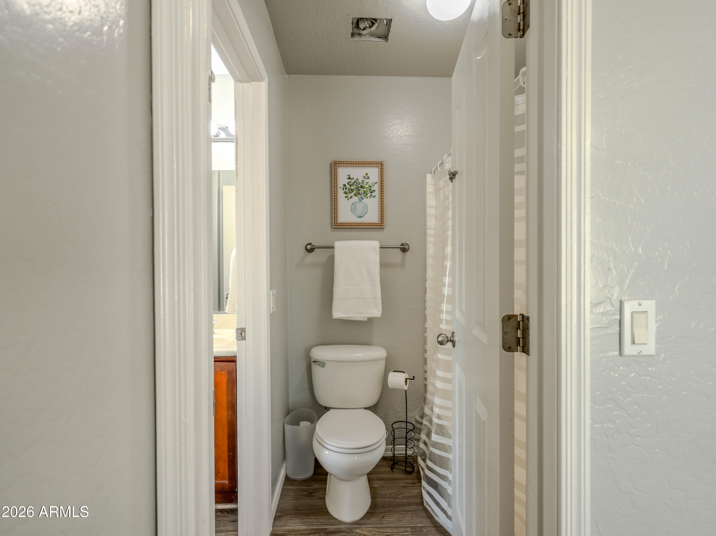 3378 East Silverbell Road San Tan Valley, AZ 85143 - Photo 36 of 61 a bathroom with a toilet and a sink