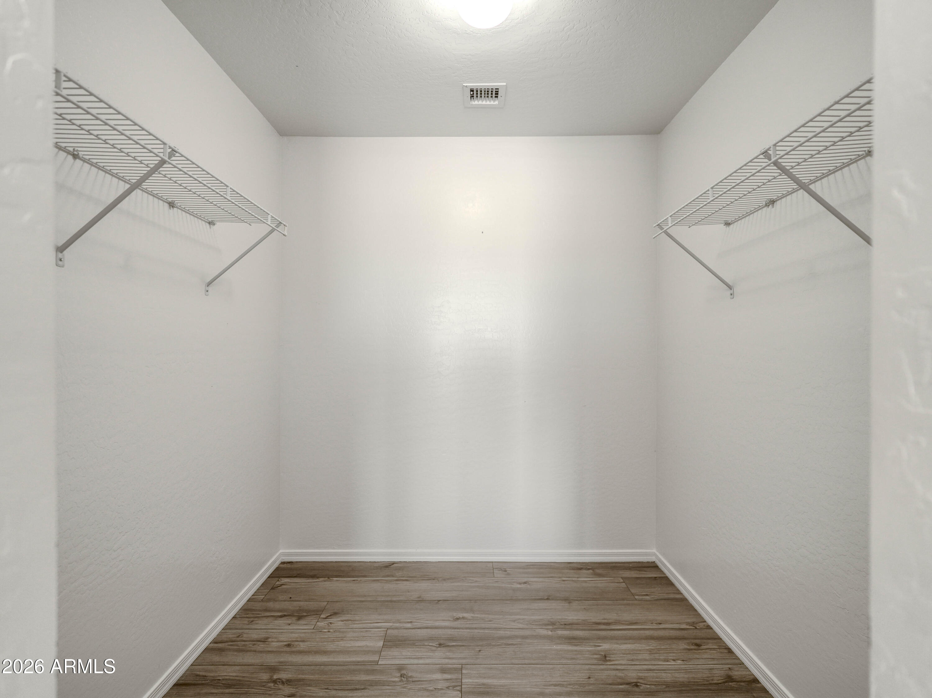 3378 East Silverbell Road San Tan Valley, AZ 85143 - Photo 42 of 61 a view of a room with racks on the wall