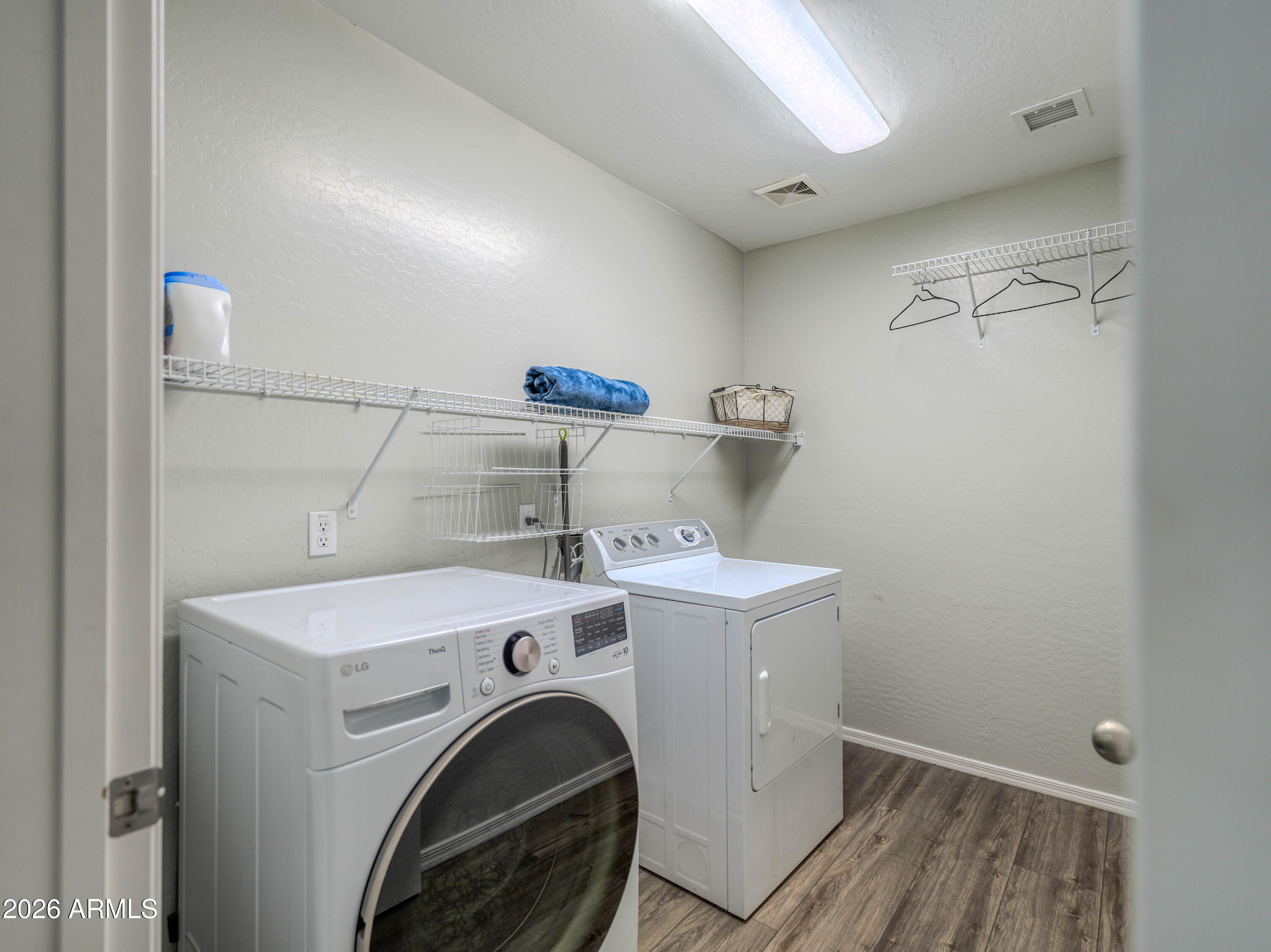 3378 East Silverbell Road San Tan Valley, AZ 85143 - Photo 45 of 61 a utility room with dryer and washer