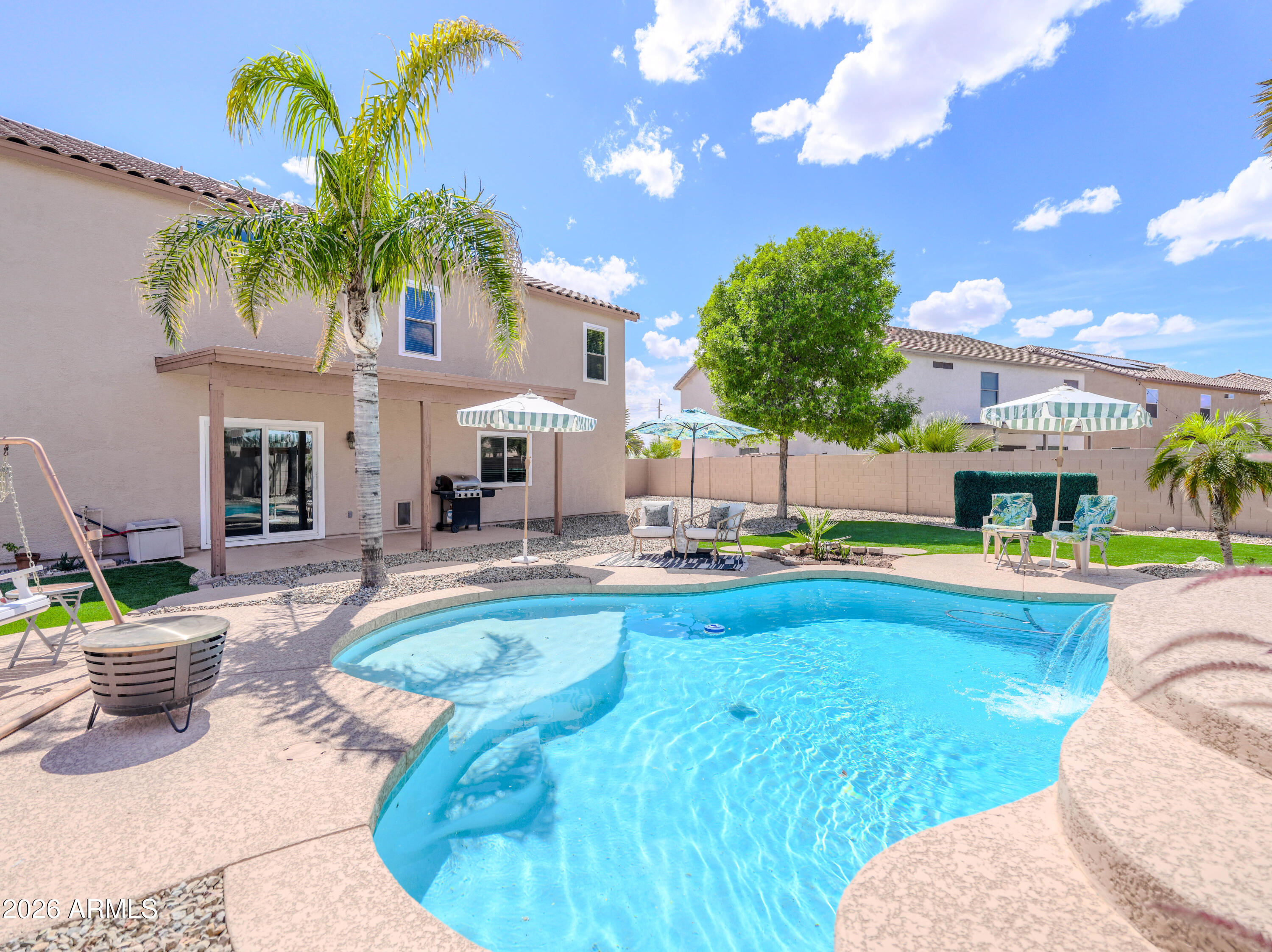 3378 East Silverbell Road San Tan Valley, AZ 85143 - Photo 5 of 61 a view of a swimming pool with a patio