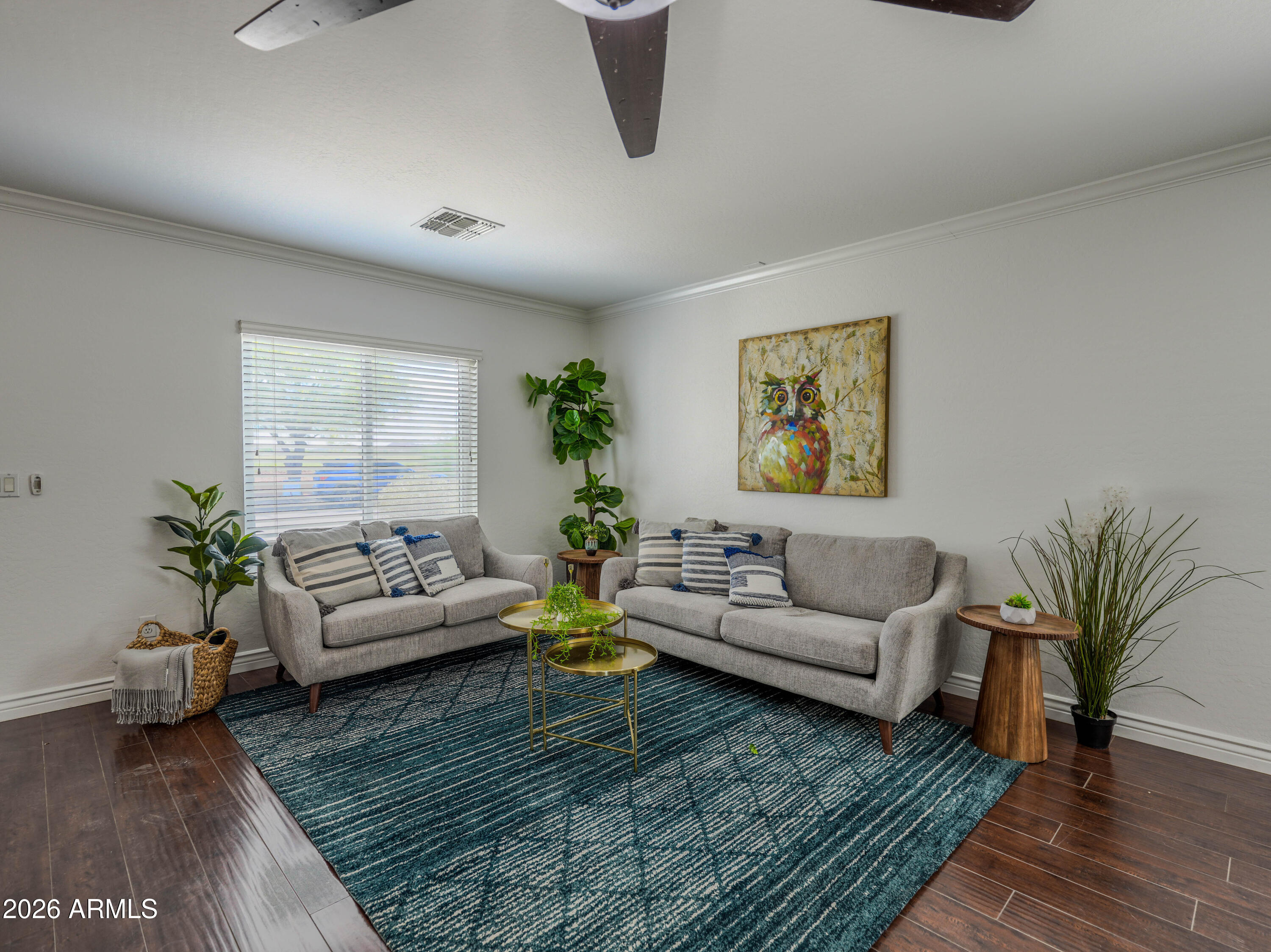 3378 East Silverbell Road San Tan Valley, AZ 85143 - Photo 8 of 61 a living room with furniture rug and wooden floor