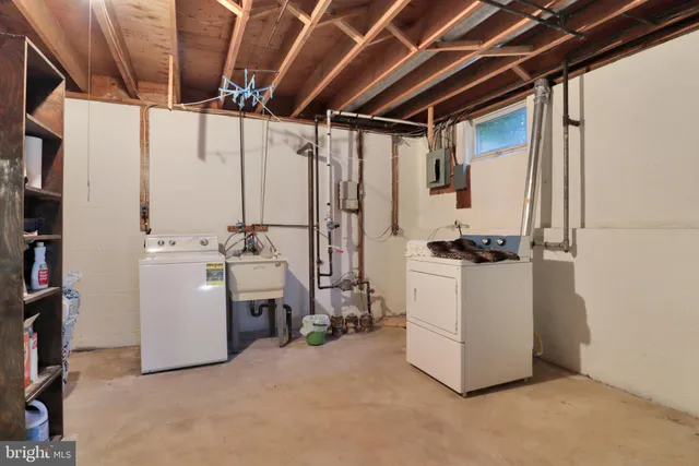 a view of an empty room with windows