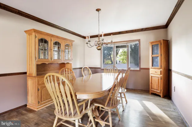 a view of a dining room with furniture and window