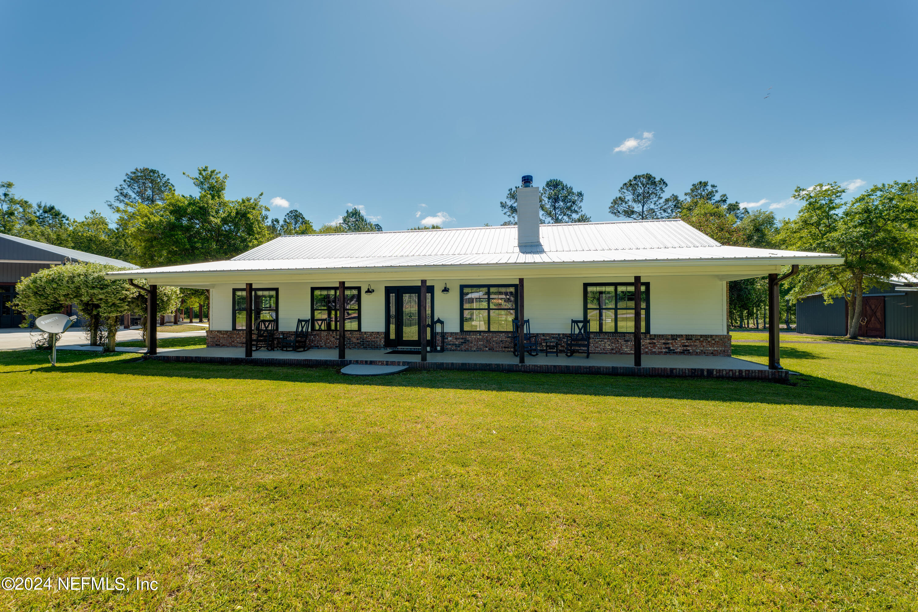 5800 Retreat Road Keystone Heights, FL 32656 - Photo 11 of 121 a front view of a house with swimming pool yard and patio