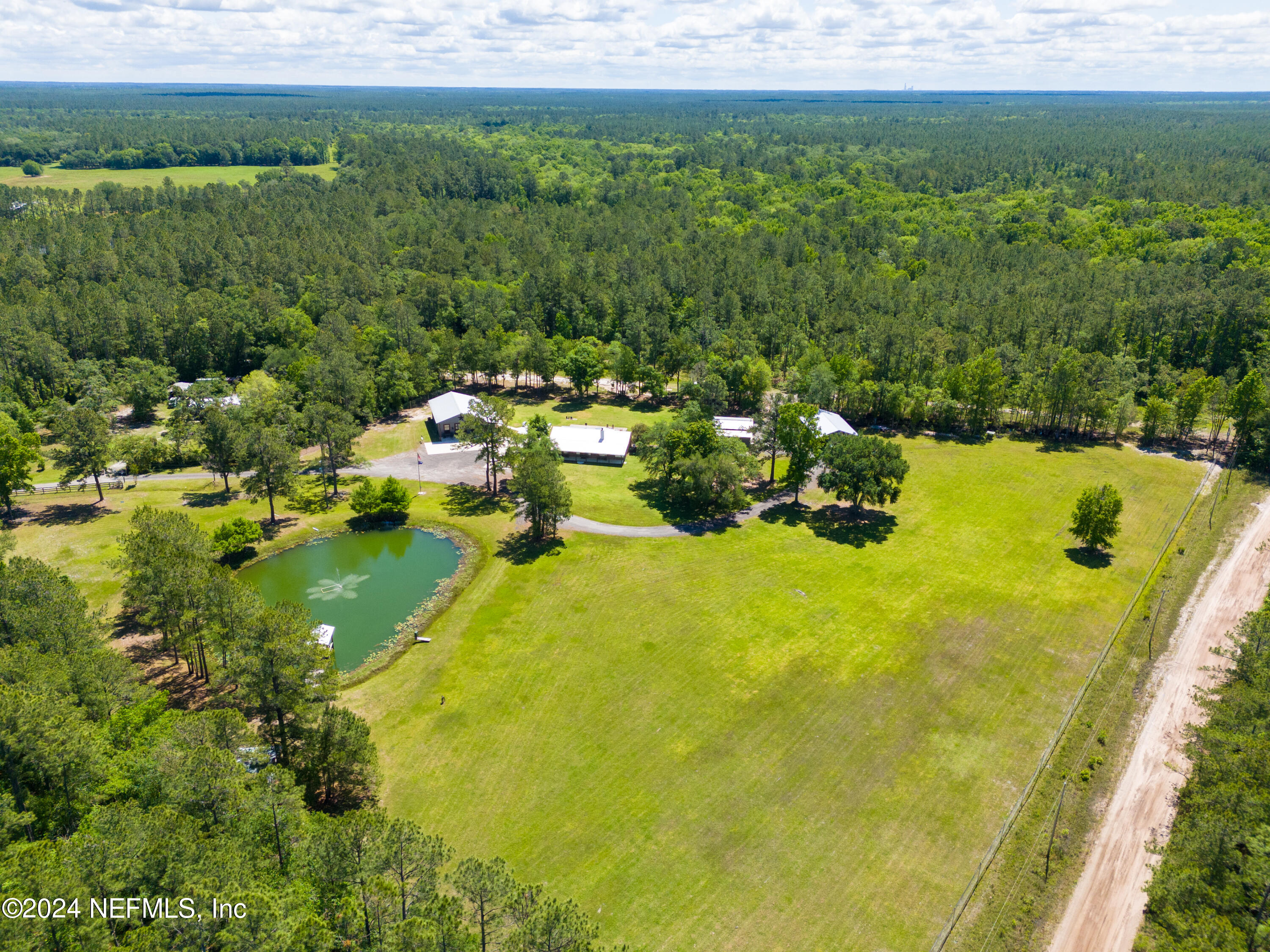 5800 Retreat Road Keystone Heights, FL 32656 - Photo 2 of 121 a view of a lake with a yard