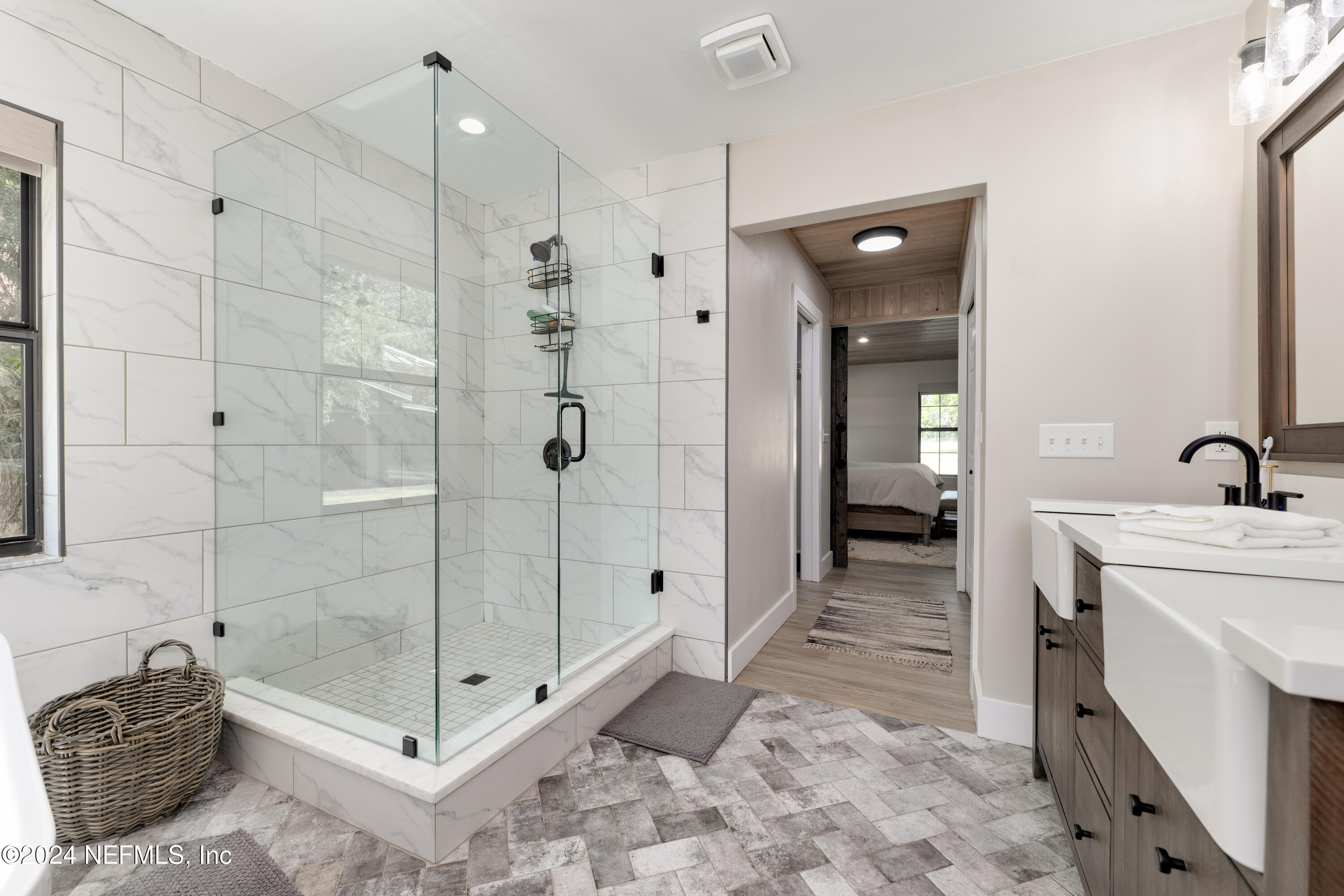 5800 Retreat Road Keystone Heights, FL 32656 - Photo 44 of 121 a bathroom with a shower and a sink
