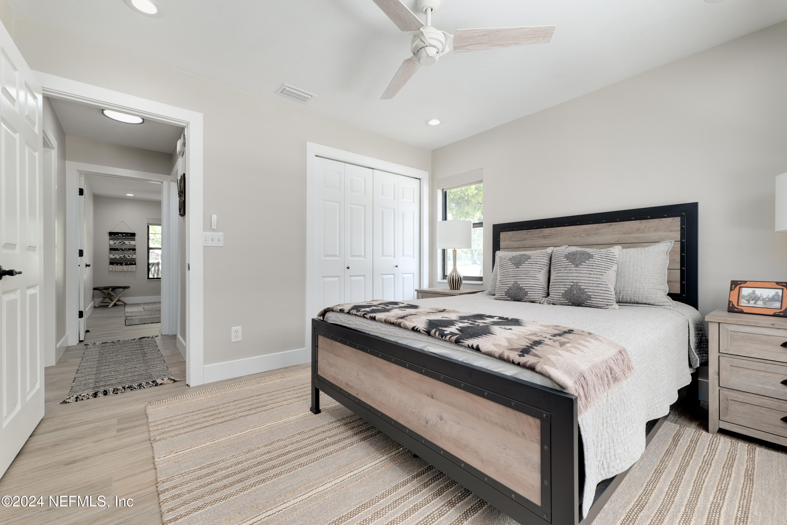 5800 Retreat Road Keystone Heights, FL 32656 - Photo 52 of 121 a bedroom with a bed and a mirror