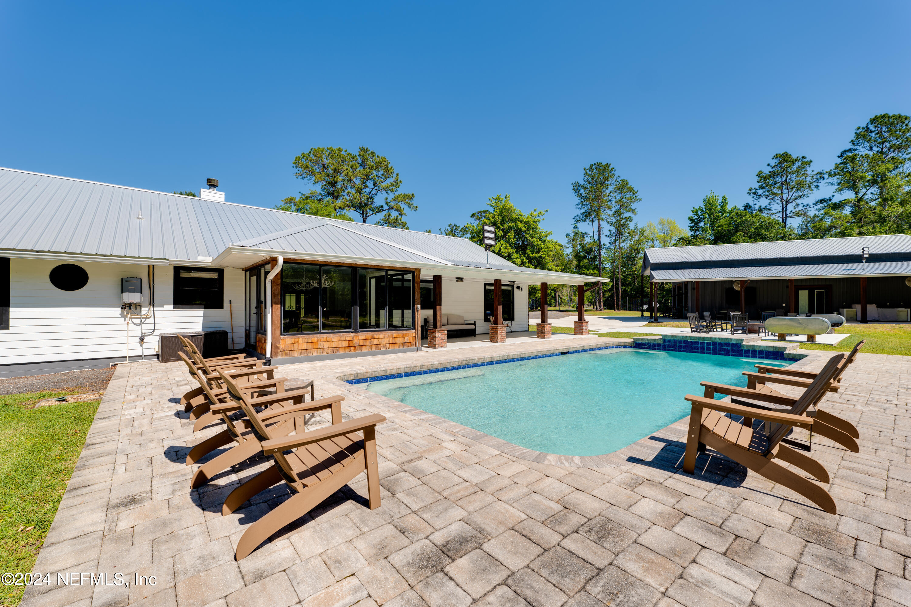 5800 Retreat Road Keystone Heights, FL 32656 - Photo 60 of 121 a view of a house with swimming pool and sitting area