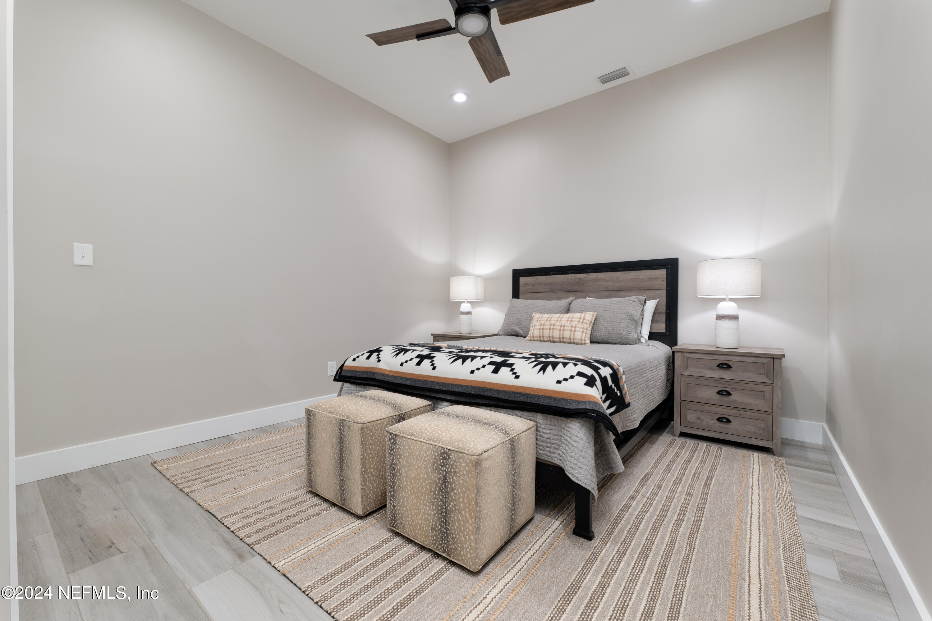 5800 Retreat Road Keystone Heights, FL 32656 - Photo 89 of 121 a bed room with a bed and wooden floor