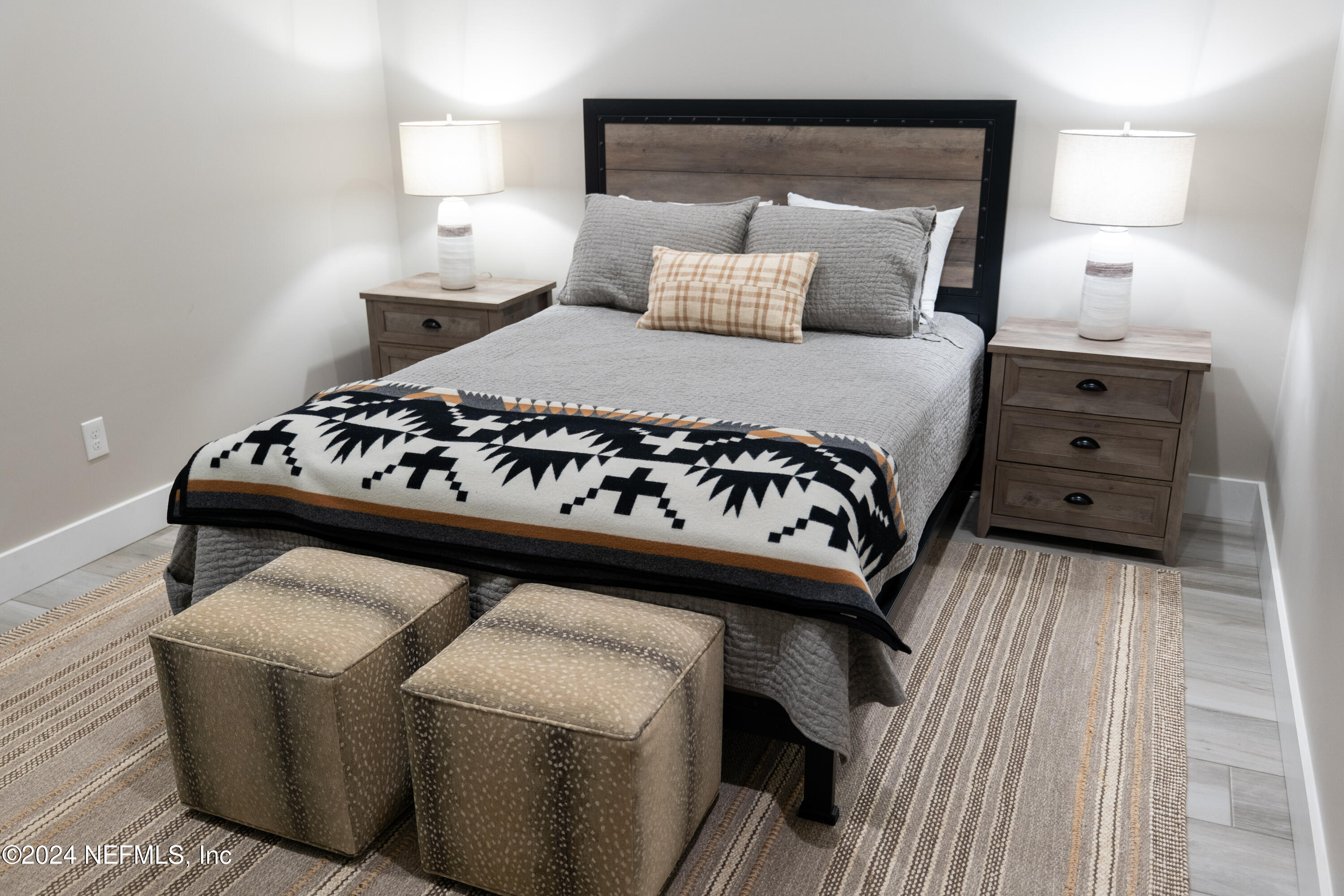5800 Retreat Road Keystone Heights, FL 32656 - Photo 90 of 121 a bedroom with a bed with a white comforter and pillows
