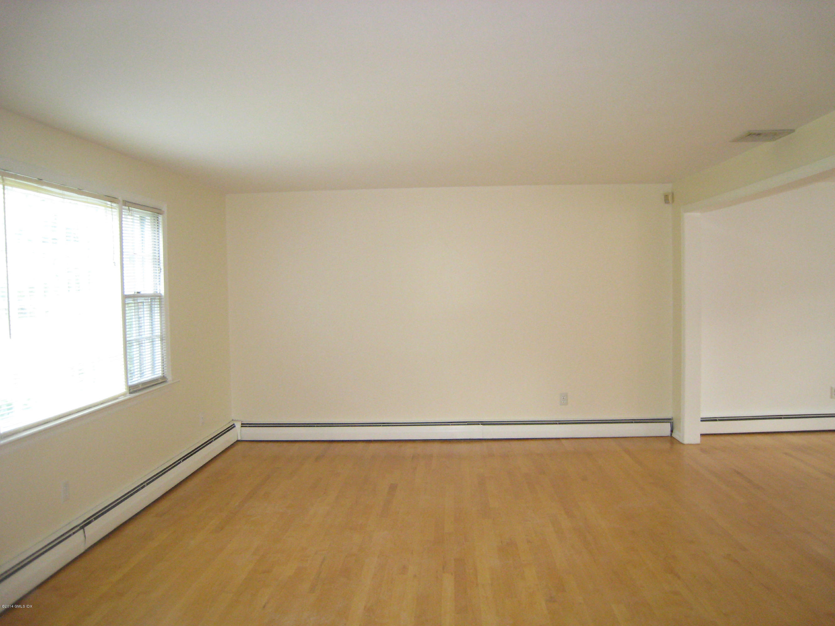 28 Rainbow Drive Riverside, CT 06878 - Photo 3 of 21 an empty room with a window