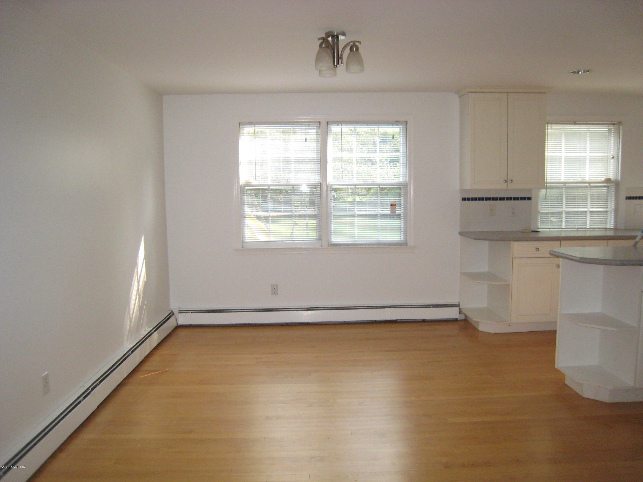 28 Rainbow Drive Riverside, CT 06878 - Photo 5 of 21 an empty room with a empty space and windows