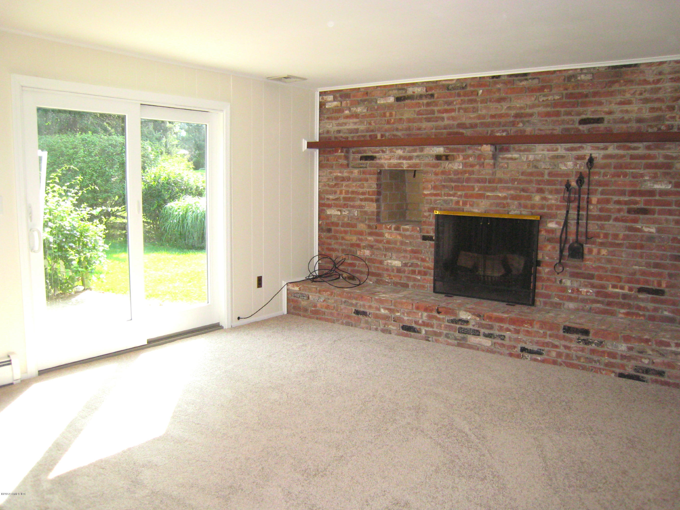 28 Rainbow Drive Riverside, CT 06878 - Photo 7 of 21 a view of empty room with a fireplace